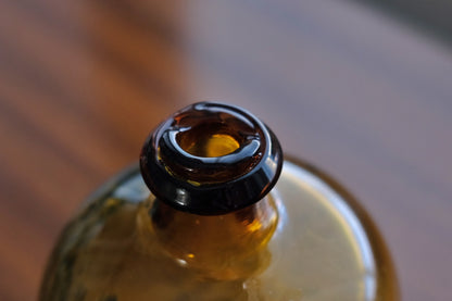 Vintage glass bottle signed